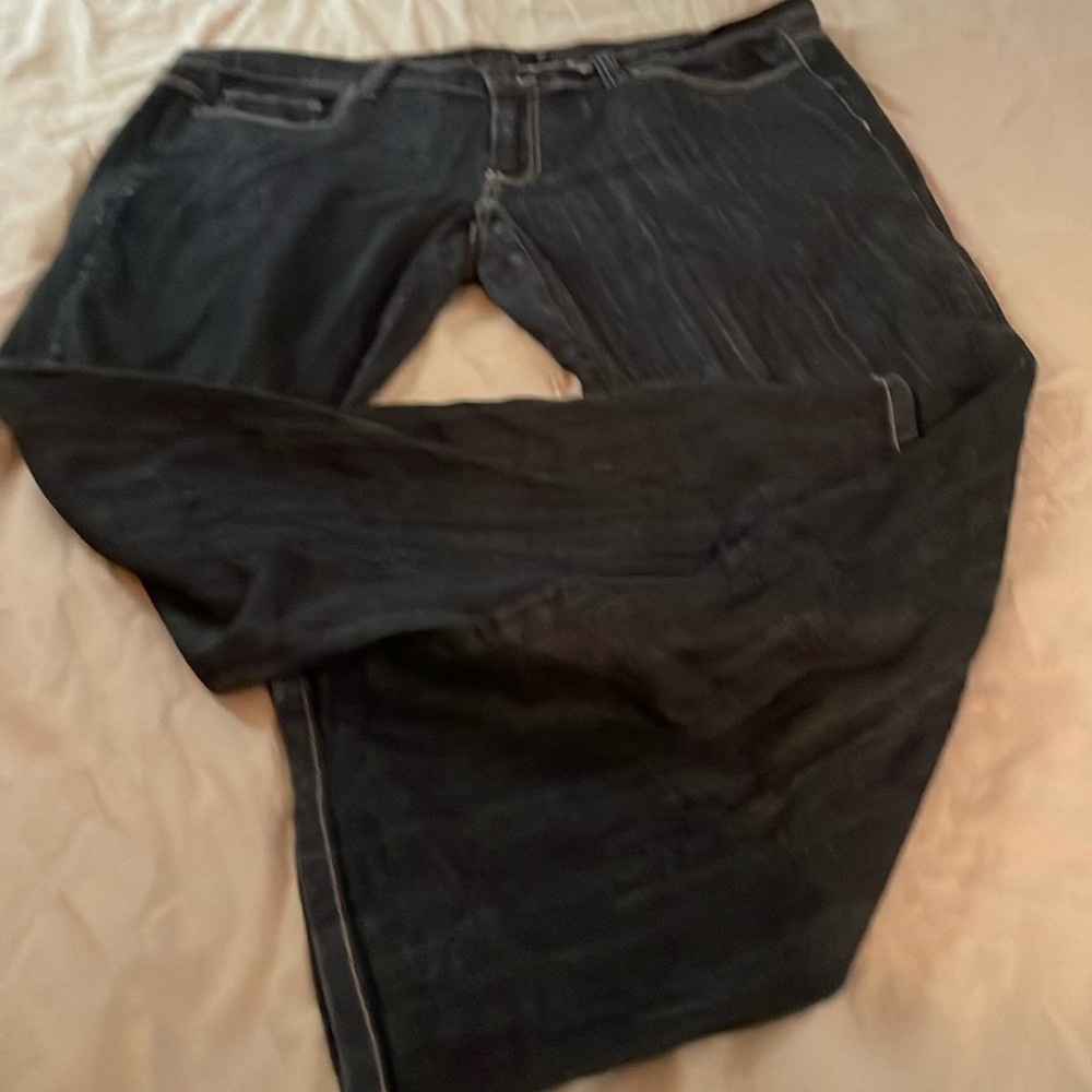 Calvin  Klein jeans with fly zipper and button. Back designed flat pocket